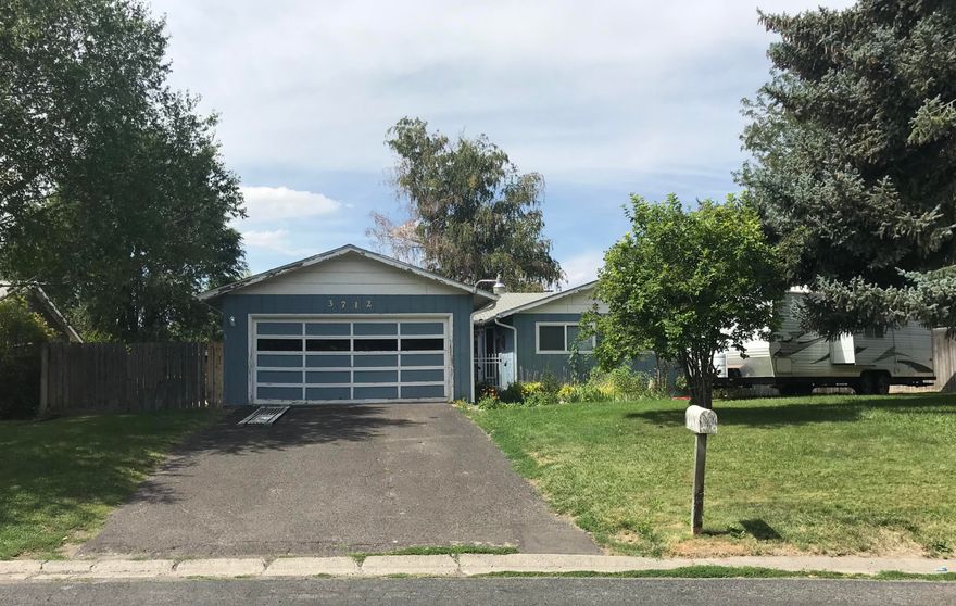 BACK ON THE MARKET at no fault of the home!!!  Opportunity awaits in Sunset Village! Come put your own touch on this 3 bedroom, 2 bathroom fixer. Home sits on over a quarter acre in town. The quiet street & pride of ownership show all around. Mature trees shade the backyard and concrete patio area. RV parking, new exterior paint and mature landscaping top off this great home.