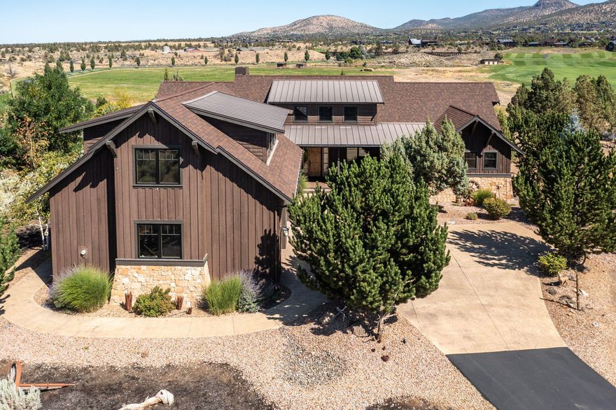 Welcome to your pristine dream home at Brasada Ranch! As you walk in the front door you will be greeted by stunning views of Outback Butte, Spirit Rock, and open pastures, this home blends luxury with the natural beauty of Central Oregon. The open-concept great room features vaulted ceilings, exposed wood beams, a stone fireplace, and hardwood floors throughout. The chef's kitchen boasts slab granite countertops and knotty alder cabinetry. A standout dining room offers coffered ceilings with rich wood beams—perfect for entertaining in style. Enjoy mostly single-level living with two spacious primary suites, an additional bedroom and full bath on the main level, plus a spacious upstairs bonus room with half bath.  A perfect blend of comfort, style, and serene ranch living.