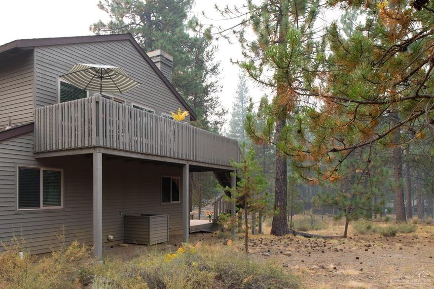 Nestled in a quiet & peaceful location near Fort Rock Park, in the heart of Sunriver. Open great room floor plan w/ clear cedar vaulted ceiling, wood burning fireplace. Granite tile counters in the kitchen with breakfast bar area. Enjoy two large decks for entertaining & enjoying the outdoors. The upper deck looks out onto the huge common area behind. The lower deck enjoy the enclosed hot tub & spacious second gathering area. New windows throughout. Air Conditioning, Single car garage, furnished, SHARC paid
