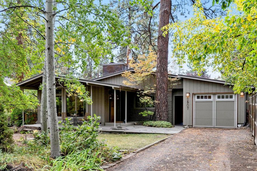 Perfect one of a kind Cottage in a highly desired location on the west side of Bend! This home has so much character inside and out, you won't want miss this one! The inviting covered front porch is an ideal spot to relax and enjoy a cup of coffee while bird watching in your front yard. Great floor plan with 3 bedrooms, 2 full baths and a finished basement. The stone fireplace, vaulted wood ceilings, and solid hardwood floors, and floor to ceiling windows bring warmth to the home and fill it with light. It has a beautifully landscaped yard with mature pine trees, paver patio, garden beds, and a custom Palapa in the backyard, which is perfect for outdoor entertaining. It even has an attached workshop off the garage. Just two blocks to Galveston shops and restaurants, and close to biking and hiking trails and more! Schedule a showing today!