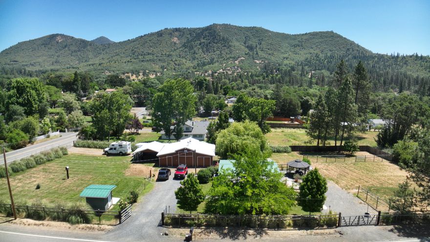 This exceptional property, rarely available, offers a multitude of features on just over a single acre. The fully fenced property includes three entrances and boasts diverse uses, such as an RV barn, horse stalls, gazebo, patios, and pasture. Meticulously maintained, this property is being offered for sale for the first time. Recent updates include a new metal roof and gutters, a new HVAC system with new ductwork, new laminate flooring, and preserved decking. The shop even features a plumbed-in air compressor. This ideally sized property has everything you could desire; we invite you to schedule a viewing.