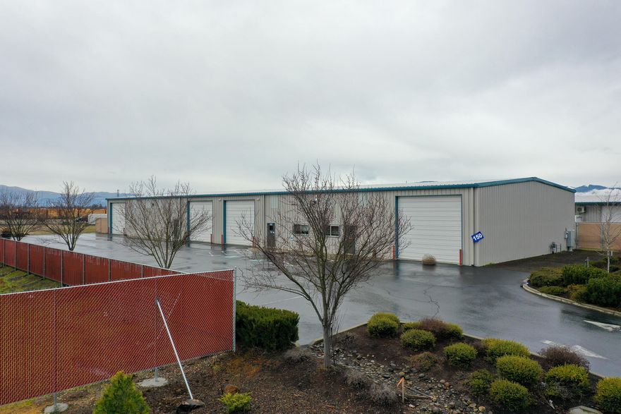 A rare and newer 9,900 sf Industrial Building built in 2013 with storage yard. This building is in excellent condition and has epoxy covered floors, a high tech security system, 3 bathrooms w/ a shower, nice office space, paved parking, the entire building is heated and cooled, and it is located in the Kirtland Rock Industrial Subdivision.  There are also 8 roll up doors and can be divided into 4 sections.  A great place to store toys!  Use some space and lease out the rest.  This building is also available for lease in lieu of purchase at $1.10/ sq ft, triple net, 3 year minimum is preferred.