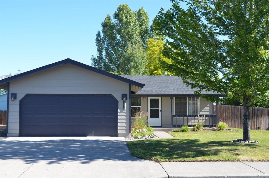 Sunny and Bright Home that has been well maintained. It is conveniently located in a nice neighborhood. This home has an easy care open floor plan with laminate and tile floors throughout. Fresh paint inside. New Natural Gas Furnace and Central AC. The Cozy Fireplace boasts a Tile Surround. Fenced and landscaped yard with automatic Sprinklers front and back. The wood deck and raised garden area make for a fun back yard. A storage building keeps it tidy. Newer roof. Move in Ready