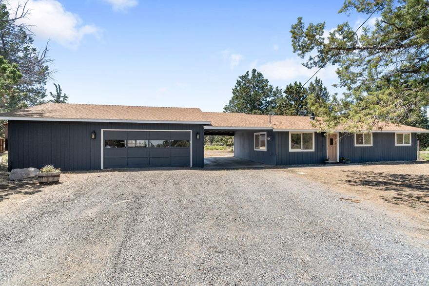 Enjoy Cascade views from this inviting single-level home on a 2.19 acre corner lot between Bend and Sisters, located in the desirable Sisters School District. Just minutes from BLM trails for hiking, horseback riding, or exploring the high desert. The home features a 2-car garage with two storage rooms connected by a breezeway—which could be finished for additional living space or a home office. Recent updates include a newer HVAC system, quartz countertops, a hand-tiled shower, and a new roof over the house. Outside, you'll find covered RV storage, a shop area, and three versatile stalls for horses, hobbies, or extra storage. A fenced area is ready for your future garden, while the open landscape offers a blank canvas for your dream yard. Peaceful and scenic, this property is just 12 minutes to Tumalo or Sisters—ideal for those seeking space, views, and proximity to Central Oregon recreation.