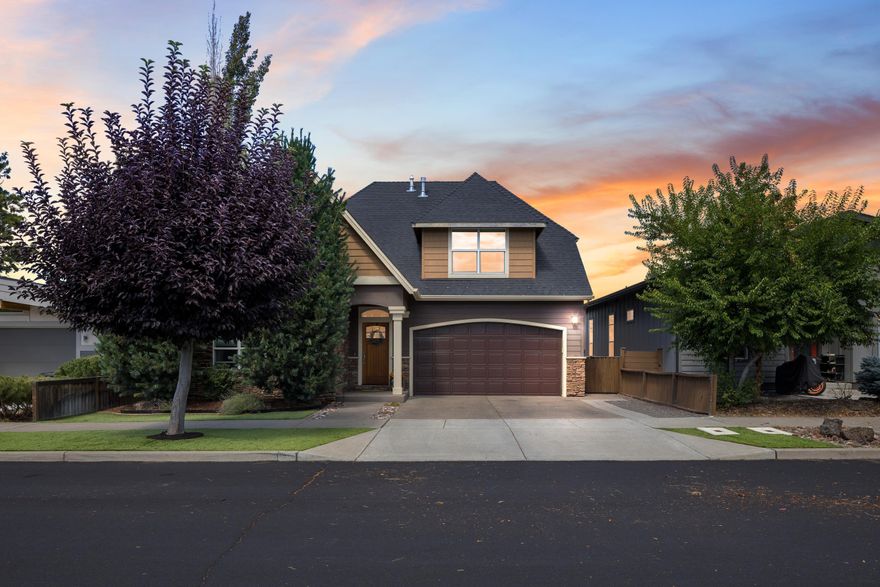 Located on a quiet cul-de-sac just steps from scenic trails and the Deschutes River, this beautifully crafted 4-bedroom, 2.5-bath home offers the perfect blend of style, comfort, and convenience. The custom Northwest Contemporary design features high vaulted ceilings, maple hardwood floors, and a striking waterfall granite island in the chef's kitchen. The primary suite is conveniently located on the main level and boasts an updated spa-like bathroom. Upstairs, a versatile bonus space offers endless possibilities—perfect for a media room, home office, or play area. Step outside to a professionally landscaped backyard oasis complete with a cozy firepit and a separate lower garden area—ideal for relaxing or entertaining. Just minutes from Blakely Park, the Old Mill District, and Downtown for shopping and concert-going, this home offers the best of Central Oregon living in a peaceful, private setting.