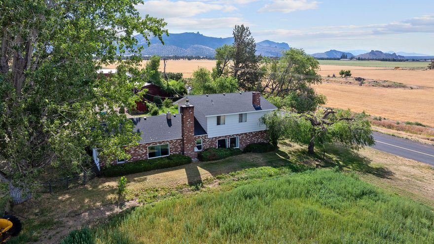 Charming country home on 35+ acres with Irrigation and Mountain views. Beautifully maintained 2,916 sq ft home on 35.44 acres just north of Terrebonne in Culver. With apron 27 acres of Deschutes water rights, this property is ideal for livestock, farming, or enjoying wide open spaces. 

Inside you'll find a spacious living room, bright dining area with brick accents, and hardwood floors. The primary suite includes a walk-in closet, large bathrooms, and a private office or flex space. Stay cozy year-round with propane forced air heating and a freestanding propane stove and pellets stoves. Outside features a barn with horse stalls, equipment storage, full fencing, fruit trees, and stunning Cascade Mountain views. A perfect blend of rural charm and functionality - don't miss it!