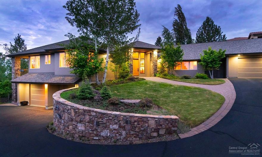 This elegantly crafted custom Earth Advantage home by SolAire Home Builders gives intimate spaces for versatile experiences. A stunning 2-sided, floor-to-ceiling stacked stone fireplace is the centerpiece of the generous great room, providing warmth and comfort. The spacious master suite adjacent to a private office/sunroom opens to a charming paver patio, and its two story solarium with passive solar design is among the many enhanced finishes to encourage complete enjoyment for both the body and mind.