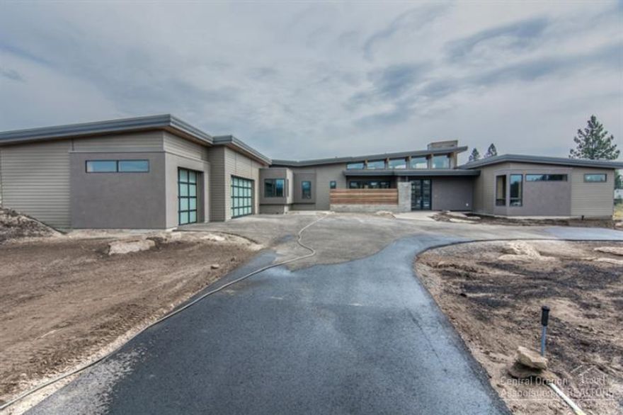 A fusion of sleek contemporary with the warmth of NW sophistication makes this Tetherow home a show stopper you can't miss. The single level 3,312 sf design boasts wow factor throughout the spacious Great Room with wood beamed ceiling and accordion glass wall, 3 suites, bonus, office and Bend Trend's coveted mud room. The spacious exterior spaces are an entertainer's delight featuring a tranquil front courtyard and covered back patio with outdoor cooking overlooking the fairways of Broken Top golf course.