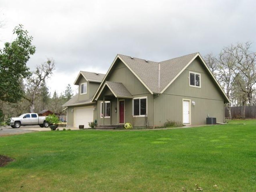Fantastic setting with home well back off of the road with a meandering drive through the woods,opening up to a meadow with this two story home built in 2007 with dormers. Open downstairs with living, dining, kitchen. All three bedrooms are upstairs. The over-sized, finished two car garage has extra room for shop. The home-site offers privacy with the large yard and garden area fenced with six foot cedar fencing. Two areas established for RV parking.