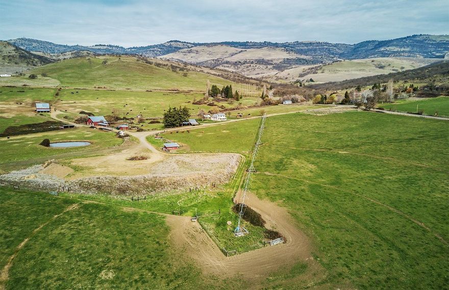Extremely rare opportunity to own a 182+ acre expanse of prime real estate just minutes from downtown Ashland, Oregon! It's complete with a modestly updated farmhouse, 95 acres of irrigation rights, barns, pond, incredible views and diverse possibilities! Preliminary research suggests the property could be partitioned into 3 tax lots, splitting off two 35+/- acre parcels, each with homesite capability, irrigation and magnificent views. Completely functional as is, the unique blend of level to moderately sloping terrain, fertile soil and full southern exposure offer the possibility of a vineyard development right in the heart of Southern Oregon Wine Country and tourism! It's also an ideal situation for a legacy property or land investment. The property is served by Talent Irrigation (TID) and currently irrigated via pressurized line and pivot. Owner carry considered with at least 1/2 down. Buyer to conduct their own due diligence regarding all aspects of the property and intended uses.