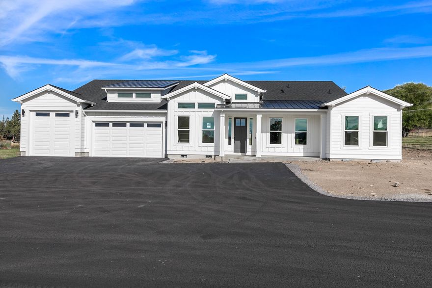 Beyond all expectations! This stunning one level just under 3400 sq ft Pahlisch Select Custom Home on 2+ irrigated acres was just completed. Upon entering, prepare to be captivated by the expansive open concept with 12' ceilings, gorgeous locally built upgraded cabinets & entertainer's dream kitchen! Huge Island w/farmhouse sink and a spectacular pantry! Main suite w/dual sinks, soaking tub, tiled shower, ample storage and large walk-in closet. Opposite of the main suite is rec/flex room w/access to covered patio, 1/2 bath, 2 bedrooms with Jack/Jill bath, & a full guest suite. All the hard work, decision making and tedious waiting has been done! Very peaceful setting w/Cascade Mountain views, lush green fields and your own pond surround you. Irrigated ground has underground automatic sprinklers for ease of maintenance. Power and sewer are upgraded and ready for your dream shop w/ADU to be added if you desire. All of this within just minutes to town!