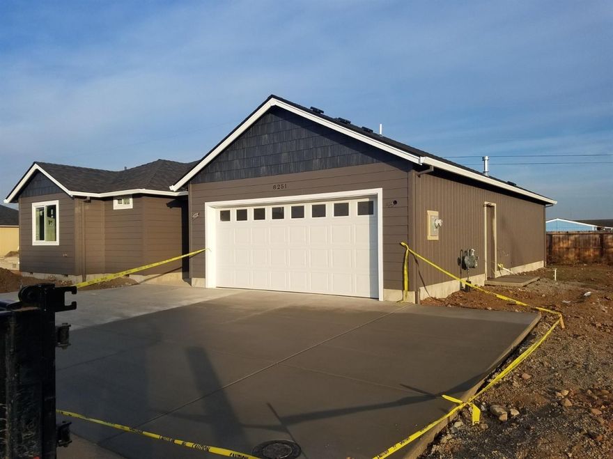 Wonderful new construction in White City. This home features granite counter tops throughout, stainless appliances, laminate wood flooring, and walnut stained cabinets. This is a very functional floor plan. Property will be completely fenced and landscaped.