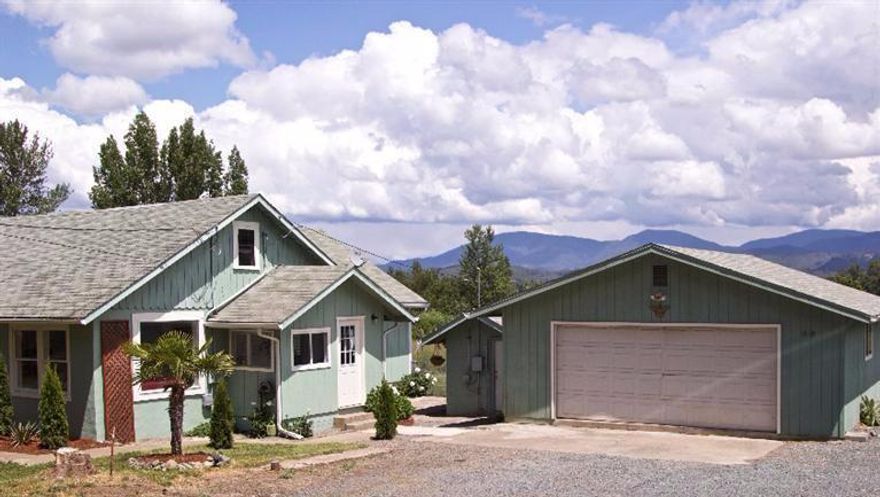 You can bring your farm animals to live in the chicken coop or small barn at this sweet farmhouse on just under one acre. The large master bedroom has a wonderful view of distant mountains beyond the pasture. There are 2 smaller bedrooms and a large area upstairs that you could use for storage. The kitchen has some updating and there is plenty of storage space throughout the house. Move in ready!