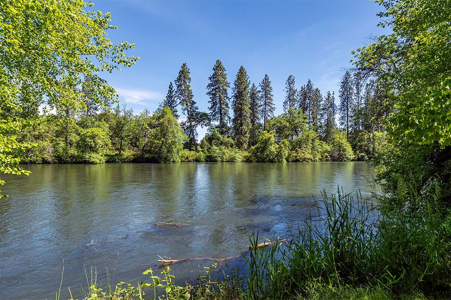 Extraordinary opportunity to own a gated riverfront estate on over 8 acres of premium irrigated land! Located on a highly sought-after & pristine stretch of the Rogue River! The owner of this sophisticated home is a premier interior designer who thoughtfully created the perfect blend of style, function, & comfortability! 29ft floor to ceiling windows capture the abundance of light & highlight the beautiful wood & steel beams & the views of the close to 300 ft of river frontage. 2-story marble slab fireplace surround. Custom stained California chestnut flooring & trim. Stunning chef's kitchen w/Thermador appliances & marble countertops. Main suite features double vanity & walk-in shower w/soaking tub. Beautiful loft style office! Bonus room w/door to exterior creates additional living space- endless possibilities! 3 bay shop, parklike landscaping & plenty of space for horses. One of the only properties with its' own boat launch complete this noteworthy property! *VIDEO TOUR AVAILABLE*