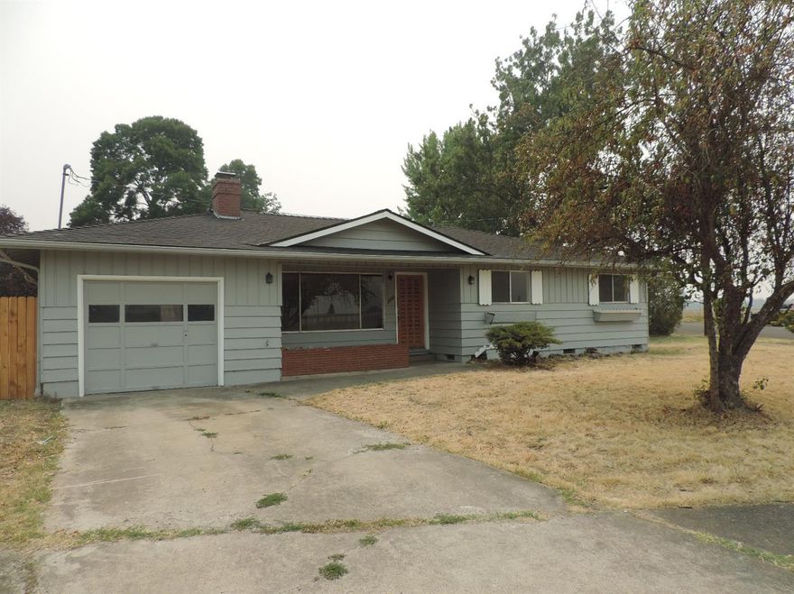 First time home buyer or investor alert! Three bedroom, two bath home located in East Medford on a large corner lot. New roof, paint, refinished flooring, new vinyl. Close to shopping, schools.