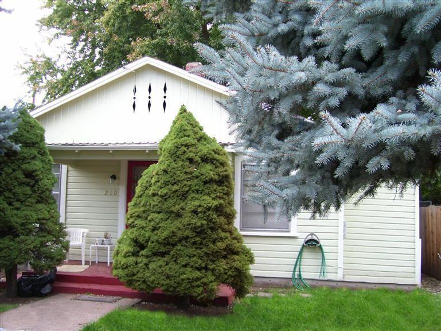 This is an amazing value! this lovely little cottage has two bedrooms & one bath, wood floors, a new roof in 2014, a covered front porch a large yard in the back that is fully fenced. Both front and back yards have been newly planted. In the back you'll find a large storage shed as well as gated off street parking with alley access.