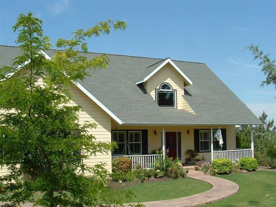 This is one of the finest homes in Jefferson County. 9 foot high ceilings throughout. Master on main level, as well as 2nd master upstairs. Alder cabinets with tile counter tops and stainless steel in the open kitchen. Hardwood floors and a great fireplace with cherry wood finishes. Formal dining and living areas. Wrap around deck. Perfect, yet low maintenance yard. 2641 SF finished living area with 1800 SF daylight basement. Pride of ownership is evident. Call today for a showing.