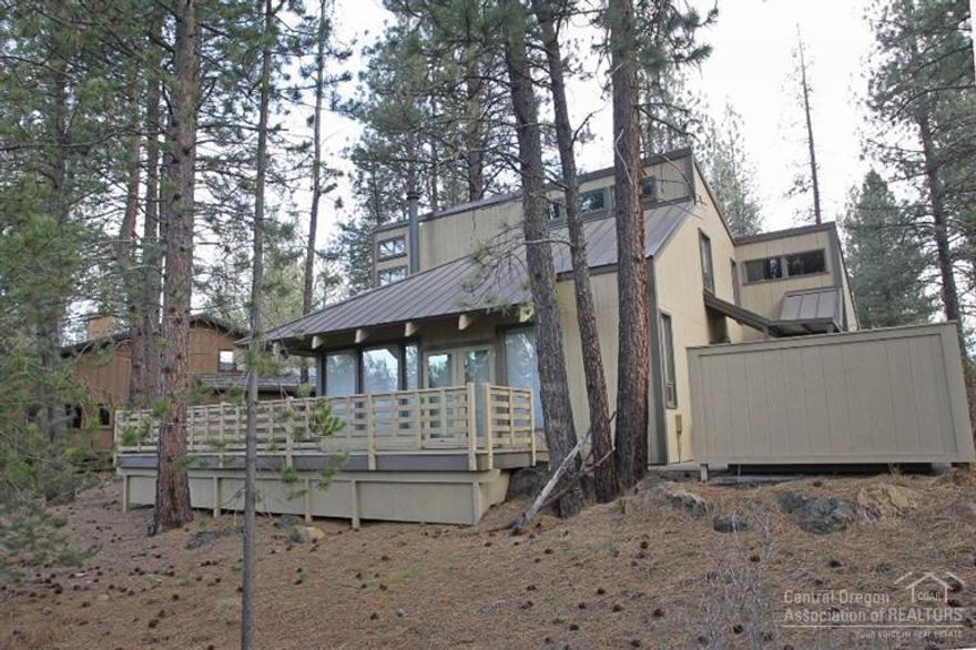 Great Sunriver home with open floor plan. Completely remodeled home offers a spacious Great Room with open kitchen and dining area. Kitchen features slab granite counter tops, eating bar and wood floors. Vaulted ceilings with wood beams in Great Room. Second floor features 2 bedrooms with a Jack and Jill bath. Enjoy the hot tub on the expansive deck while looking onto the common space. Close to the South Pool, the Village Mall and Meadows Golf Course.