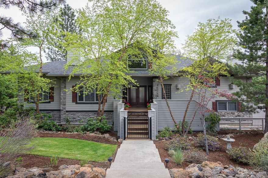 It's hard not to love this home once you step inside! You will find yourself saying ahhh as its warm ambiance greets you. Northwest in style, this home has a great personality with a rustic yet elegant atmosphere combining stone, beautiful woods, lovely tile work, high ceilings & picture windows. Perfect for entertaining, plenty of room for your guests to wander & mingle from the 2 spacious living rooms, each w/a fireplace that flow to a formal DR, & spacious kitchen that has cherry cabinets, granite counters newer appliances, 2 islands, & dining nook. A main level Master en suite w/sliders to the deck is adjacent to a large office w/yet another fireplace. Enjoy the sunrise & SE views from the expansive & newly refinished deck surrounded by lush landscaping & towering Ponderosas. Tons of storage including a rare 4 car garage w/a shop! Other amenities include radiant floor heat in the Master Bath, a bonus room w/a separate entrance & a steam shower. This home is a must see!