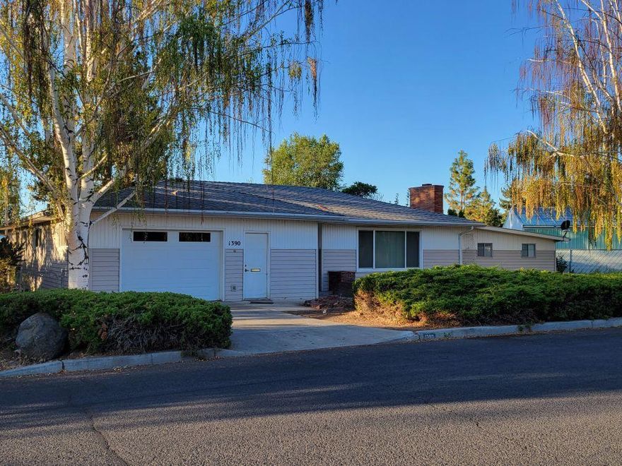 This home is in a great neighborhood, that seems to be desired by many. Close to the Barnes Butte trail system, recreational area and also Barnes Butte Elementary school. 3 bedrooms and 1.5 baths, large living room, fireplace insert and nice covered back patio. There are 3 solar tubes, one in the kitchen and 2 in the dining areas for additional natural lighting. The main bath is in the hallway by the bedrooms with the 1/2 bath located in the laundry room area. The garage is on one side of the home which is insulated and finished and there is a covered carport area on the other side for additional parking accessed by the alley. Home does need updating and new flooring. Additional information available.