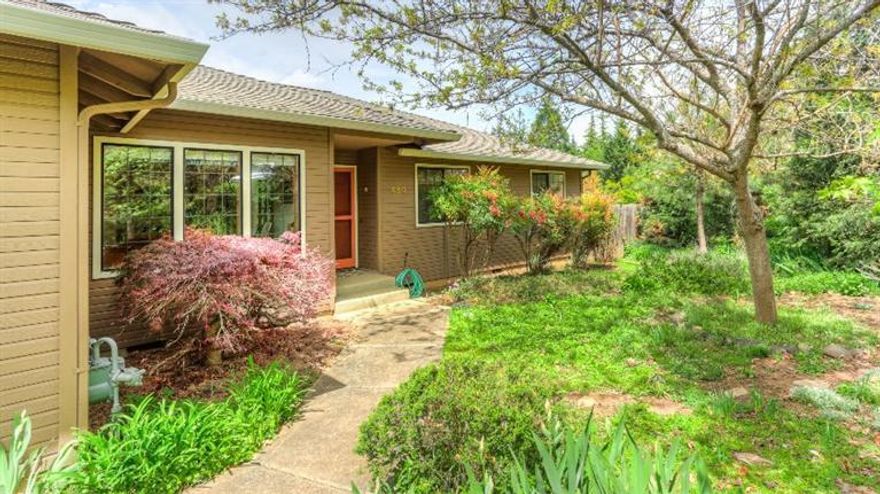 Private, Peaceful Single-Level Home in Ashland! This charming 3 bedroom, 2 bath, 1,975 square foot home in a magical, park-like setting features an open oak and hardwood kitchen with high-end stainless appliances, family room with wood-burning fireplace, formal living room with 10-foot ceilings, office with French doors, and a wonderfully sheltered deck area off the family room with beautiful grape arbor. The newer solar panels generate excess electricity to sell back, keeping power bills low. The 29/100 acre lot is beautifully landscaped with a large garden area, mature trees, great flowering plantings and a refreshing in-ground fiberglass pool. The owners have maintained the property nicely--updated roof with solar tubes and solar attic fan, fresh exterior paint, refreshed thermal windows and a fully finished double garage. Wonderful storage below the house, too. What are you waiting for?