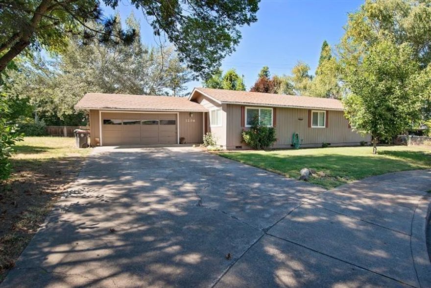 This cute 3 bedroom, 2 bath home sits on a large, .30 acre lot with lots of trees and privacy. Lots of updates in the past few years! Large open living room and dining room and nice wood laminate flooring. Kitchen with separate dining area, covered back patio and a large garage. Newer light fixtures & doors. No formal RV parking spot, but plenty of room to create RV parking on the huge and open side yard.