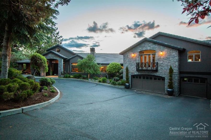 Looking for that elusive wow factor''? This Wyndemere estate has plenty. Panoramic view of Cascades, Deschutes River & miles of preserved open space from 0.56 acre on the NW slope of Awbrey Butte. Deschutes River Trail access. Views from rooms & decks on three levels. Master suite w/ sitting area, luxurious bath, his/her walk-in closets. Comfortable LR w/ fireplace. Large bonus room over 3-car garage. Two offices, library w/ fireplace. Many more wow'' amenities including indoor & outdoor swimming pools.