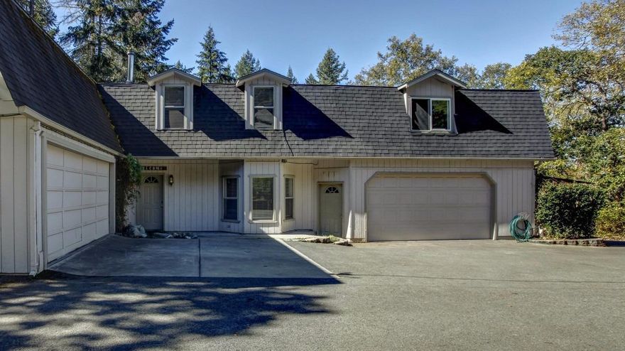 Wonderful Country Setting! Sitting on 1 acre and Built in 1993 this home features 3 bedrooms, 3 baths, approx. 3158 sqft., living room w/built-in shelves, dining room, 2-family rooms, updated kitchen w/granite counters & oak cabinets, walk-in pantry, laundry room, Lots of storage, floors are a mix of carpet, tile & vinyl and a Large master bedroom w/covered balcony. Large covered patio out back looking out over the nice large backyard w/another open patio for a pool or hot tub. Two-attached 2-car garages, a single carport, paved RV parking and Lots of additional parking for all the toys!