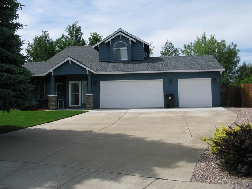 Located in the desireable NW area of Redmond, this is an Incredible home and property. Large home on a huge lot, .24 of an acre,  with a triple car garage and RV parking. Oversized main living room, lots of windows, family room off of kitchen! Brand new carpet through out the home, landscaped like a park! New exterior paint, newer roof, pergola and patio out back. There is a lot to check out at this property. Sellers have gone above and beyond to make this home and property look amazing. Included in the  sale are 2 large screen TVs, Private security system that is owned, all blinds through out the home, ALL appliances stay with the home.