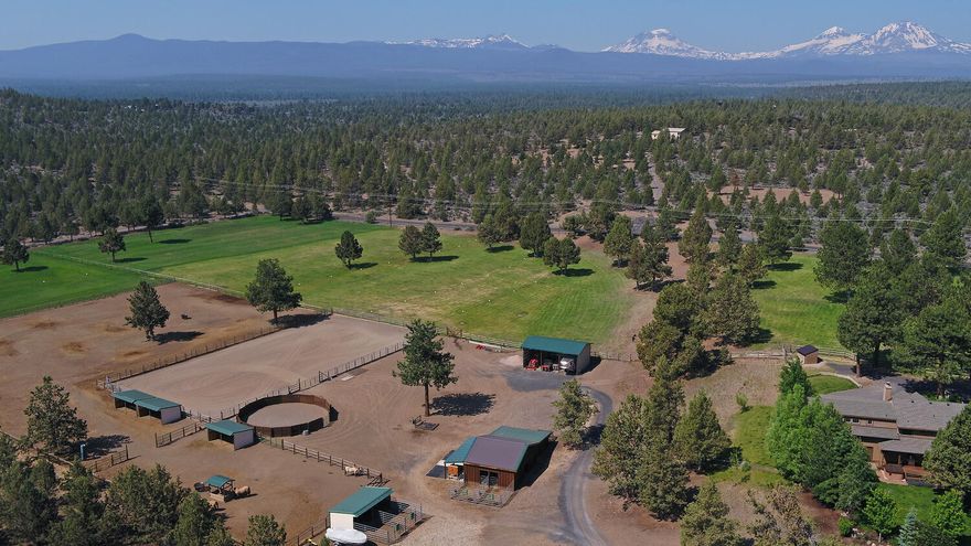 Mini ranch on park-like setting with Cascade Mountain views and end of road privacy. Ideal for horses & cattle. Fully renovated home. Direct access to 1000's of acres of BLM trails. Interior Features: Large primary bedroom with mountain view deck; Knotty Alder cabinets/doors/trim throughout; Large kitchen island; Xtrordinair wood burning fireplace; Distressed rustic oak floors. Exterior Features: Covered Wrap around porch with large deck/hot tub; 24 x 36 machine shed; Property Features: 5 acres well water irrigation rights; Entire property fenced in no-climb fencing; 2 stall barn with insulated & heated tack room; Attached shop & large chicken coop; Matted tack up area; Wash rack; 60 foot diameter round pen with solid sides and sand footing; 100 x 200 outdoor sand arena; 2 large dry lots with 3 large matted loafing sheds. Extra stand alone loafing shed with 2 stalls; 2 separately fenced irrigated pastures; Farm deferral for low taxes. Easy access to Sisters & Bend. Sisters School