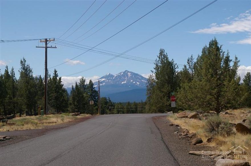 The lot has been cleared of underbrush. Lot is located on a paved road. Power line runs directly in front of the property. Flat build able lot with possibly mountain view if the home is positioned correctly on the lot. The lot is surrounded by custom homes and past Tour of Homes award winning homes.