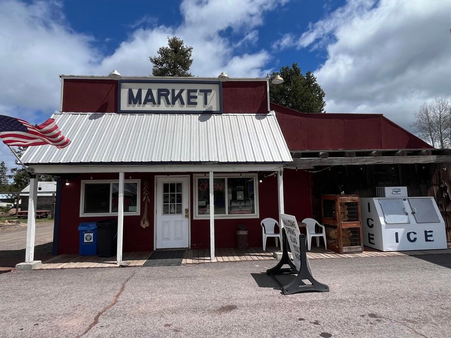 Mountain Market is a locally owned and operated convenience store servicing the community since 1939.  Highway Frontage. Along with the grocery, liquor and deli sales are hunting and fishing license sales.  Property also includes a 1612 Sq Ft Manufactured home with a shop/Garage.  Great opportunity to Live and Work or rent out for additional income.  Call for your tour today.