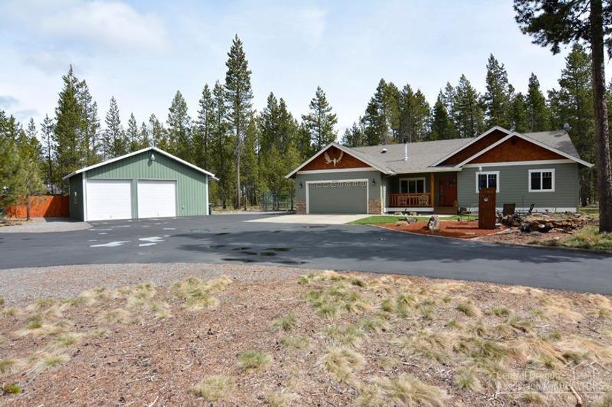 This home is located on 4 tax lots giving you 2 acres.Built in 2003, updated in 2016. Gated entry with paved driveway, 30 x 30 shop, covered parking & hook ups. Green House, landscaped, fenced, water feature, covered front porch & large deck. Walk into living room with wood vaulted ceilings, wood stove, wood floors, 9ft ceilings throughout, solid door. Upgraded bathrooms new solid kitchen counter tops new roof new interior paint. This home shows pride of ownership. Access to river down the road.
