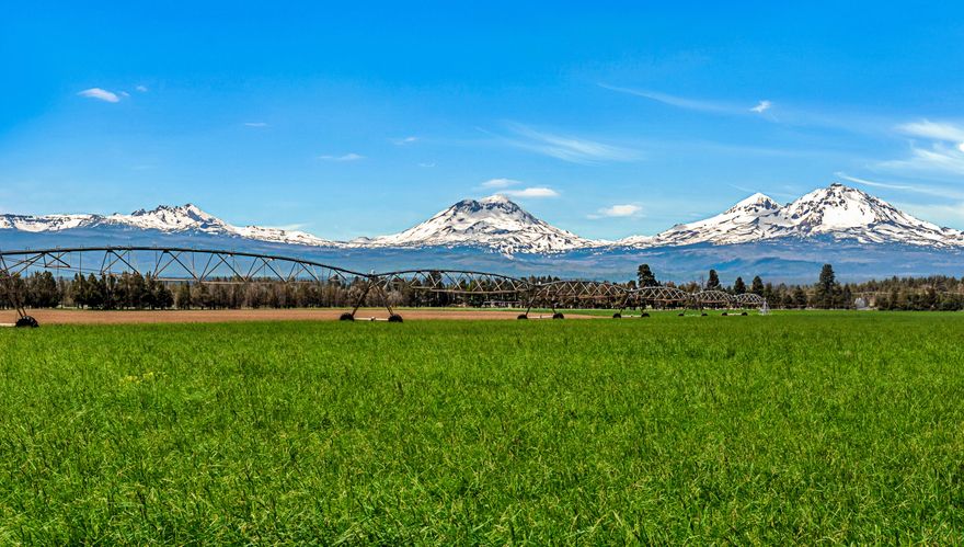 Cloverdale! 300 acre working farm with 240 acres of 1895 water rights and spectacular mountain views! 2 homes and Deschutes County indicates potential for a 3rd home, plus hired help and hardship dwellings.  Could be a tremendous family legacy vacation retreat or multi family compound.  This is one of the most desirable locations in Central Oregon -- featuring the Cloverdale micro climate, outstanding mountain views, pressurized TSID irrigation water, and close proximity to Sisters and Aspen Lakes Golf Course. Hay from this property sells at a premium to a well established clientele of repeat buyers of premium Orchard grass, Teff and Alfalfa hay sold for horses. Irrigation water is pressurized delivery, no electric bills for pumping!