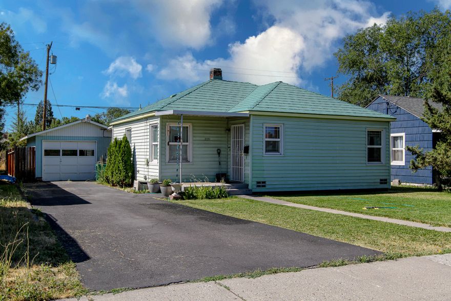 Welcome to your cozy retreat! This delightful 2 bedroom, 1 bath home is perfect for first-time home buyers or those looking to downsize. Nestled in a centrally located neighborhood, it features bright and airy living space, a quaint and functional kitchen, and a lovely fenced backyard perfect for pets, summer BBQ's, and gardening. The laundry is spacious enough to double as a mud room and detached garage with concrete floor  is perfect for a car enthusiast or workshop. Roof on this home Is metal and extremely low maintenance. Prime location with shops, groceries, and more just minutes away.