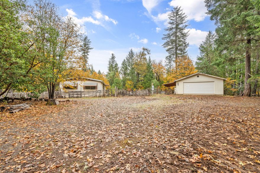 Beautiful secluded treed little spot. Gated, complete privacy. Manufactured home could use your vision or replace with a modern manufactured or a stick built. Amazing oversized detached two car garage / shop with its own bathroom. About 19 minutes to Grants Pass. Priced great to make this project worth your while. See Instructions.