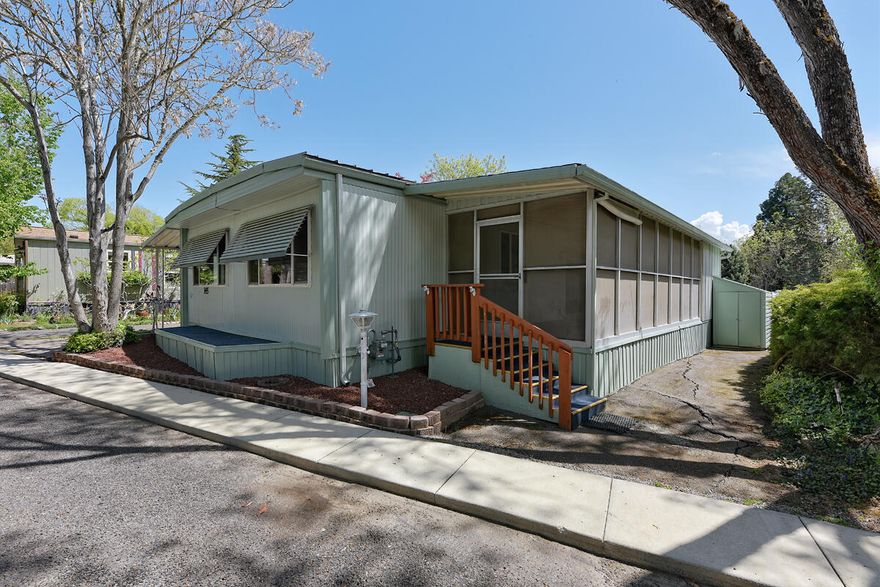 Have you been searching for an affordable home in an excellent 55 and older community? This may be the place for you! Located in the highly desirable Royal Mobile Estates in the historic town of Jacksonville. This home is located near the back of the park in a quiet and peaceful spot. The home has a large living room and spacious dining room. Off of the kitchen is an additional seating area and a large sliding glass door that leads to a spacious covered porch. The primary bedroom has a nice sized closet and on-suite bathroom. The additional bedroom and bathroom are also a generous size. There is a storage room off of the laundry room as well. The home also has upgraded windows. Call today for your personal tour.