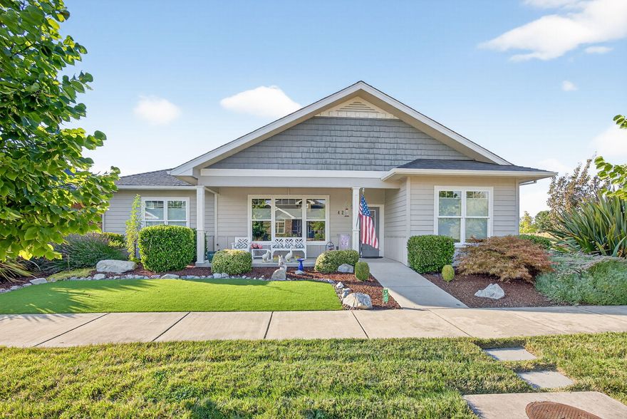 Beautiful single level, Lifelong Housing Certified 3 bedroom home in the award winning Twin Creek, near the popular Don and Flo Bohnert Farm Park, priced right and built to Earth Advantage Platinum standards. Corner lot with great curb appeal, inviting front porch, large covered rear patio, and private yard with mature hedge. Great room with coffered ceiling. Island kitchen with granite counters, custom cabinets, solatube for natural light, under cabinet lighting. Spacious dining area with large window to rear yard. Split bedroom plan. Guest bedrooms with custom closets, large guest bath with tall tub and cultured marble surround. Master Suite with laminate and tile flooring, no-step spacious shower, linen cabinet, and walk-in closet. Utility room with TONS of extra cabinets. French door to rear covered patio. Garage is finished and oversized with a workshop area at the head of one bay. Yard features artificial grass for EZ care, large hedge for privacy. Hurry on this one!