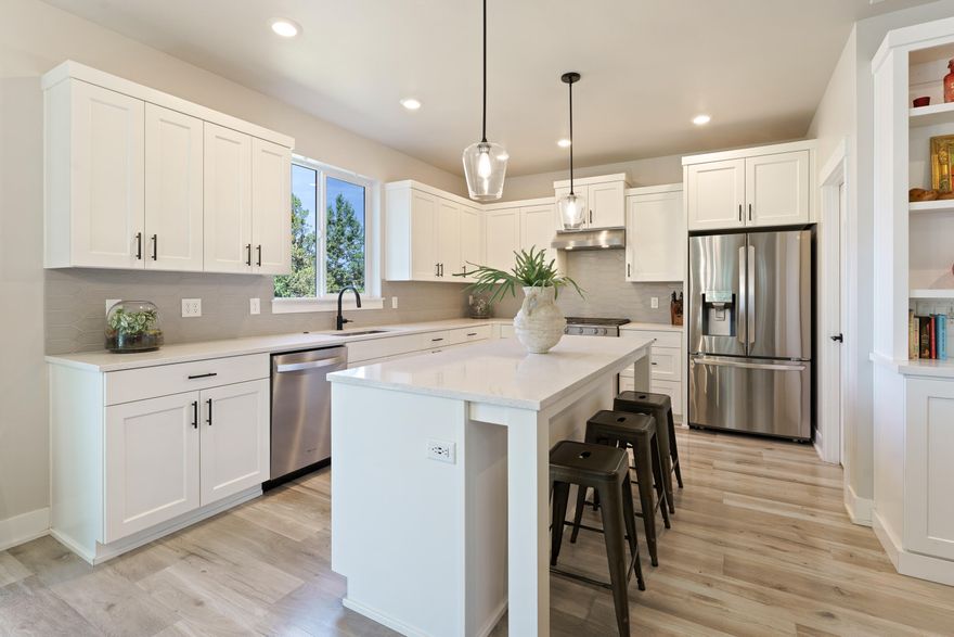 Filled with natural light and designed for comfort, this well-maintained 3-bedroom, 3-bath home offers 1,927 square feet of thoughtfully upgraded living space. The open-concept layout features custom-painted cabinetry, a built-in bookcase and desk, luxury window coverings, and a beautifully landscaped, fenced backyard that backs up to a peaceful canal. Whether you're settling in or seeking a strong investment, the home's desirable location near schools, Pine Nursery Park, Pilot Butte, and everyday conveniences like grocery stores it  offers lasting value and rental appeal. The community is loaded with amenities...walking paths, parks, a gym, pool, and clubhouse, this property pairs lifestyle perks with impressive potential.