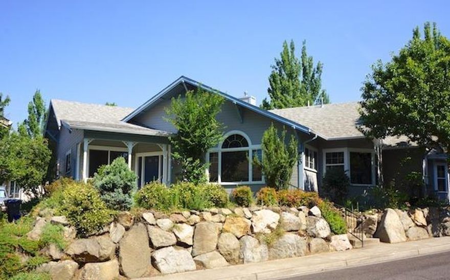 Fabulous single family home in Mountain Meadows 55+ Community! Very unique floor plan with large windows to view the community park and lush landscaping. Gas fireplace and high vaulted ceiling in the large living room and track lighting to highlight paintings and artwork. Dining room with coffer ceiling with surround lighting and wood accents and pass through from kitchen counter. Large kitchen with abundant counter space, gas range, lots of cupboards and storage space and a eating space too. Access the large patio from sliding doors in the kitchen nook area and enjoy views of the park. You can hear Kitchen Creek trickling by too. Large master suite with specially designed bathroom with oversize shower which can be accessed from the private back yard area. Back yard is fenced and has electrical hookup for a hot tub. Main entry to home has covered front porch great for enjoying those summer evenings. Attached garage with storage galore, counter space and wash basin.