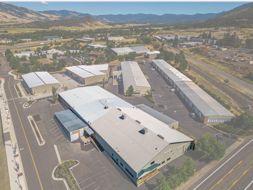 A rare opportunity to BUY or LEASE in Southern Oregon! This 37,640 SF industrial building offers exceptional features and is strategically located just off I-5, near the Oregon-California border. Situated on a prominent corner lot at Tolman Creek Rd and Independent Way within the IPCO Commercial Properties complex, the property boasts high visibility, private off-street parking, and excellent truck access. The building includes a loading dock with strong truck flow, spacious office areas, a breakroom, mezzanines, a fire suppression system, security setup, and new motion-sensing LED lighting. Ceiling heights reach up to 16', making it ideal for stacking, and ample power is available to support a wide range of operations. Zoned E-1, this property is suitable for warehouse, distribution, light manufacturing, and storage. Please note: uses related to hemp, marijuana, auto mechanics, or woodworking will not be considered.