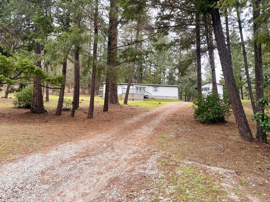 Manufactured home on 1.05 park-like acres in a quiet end-of-road setting, offering privacy while remaining close to town amenities. The property features a large shop with ample space for storage, hobbies, or projects, along with usable land that provides plenty of room to enjoy the outdoors, garden etc.
The home is in good condition and would benefit from cosmetic updates such as fresh paint and new carpet, allowing the next owner to add value and make it their own with a little TLC and fixing up. The septic drain field will require repairs, which have been considered in the pricing and an estimate is included in the docs section. New Well pump 2024!
Great opportunity for a buyer seeking space, a peaceful location, and future potential!