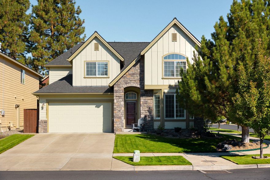 Set on a corner lot in the desirable River Canyon Estates, this bright and spacious 2-story home in Bend, OR, offers ample space for comfortable living. With an open floor plan and large windows, natural light flows throughout the 3 bed, 2.5 bath home. Enjoy easy access to the Deschutes River and scenic trails nearby. This home has been updated with a new 50-year roof and brand-new carpets. This chef's dream kitchen features stainless steel appliances, an oven-microwave combo, and a 6-burner gas range, perfect for preparing meals and entertaining. Unwind in the spacious primary suite, complete with a jet tub, double vanity, and large walk-in closet. Practical features include a dog washing station in the laundry room and a tandem garage. The outdoor space is perfect for relaxing or entertaining, with a covered patio and a natural gas firepit, surrounded by a beautifully landscaped yard. Seller is offering up to $10,000 towards buyer's closing costs or rate buy down.