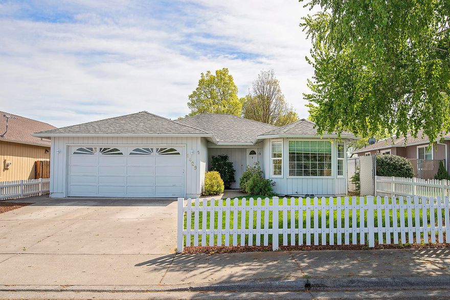 Don't miss out on this affordable SW Medford home!  Close to everything!  You'll love the curb appeal as you approach your new home!  Upon entering the house the kitchen and adjacent living room provide a nice open space for all of your guests to interact with each other.  The kitchen boasts granite countertops and stainless steel appliances.  The newly painted interior and some updated lighting and new ceiling fans provide a wonderful ambience.  The large, private, backyard has enough room to play, entertain, and have your own garden. Come enjoy all that this home and prime location have to offer.