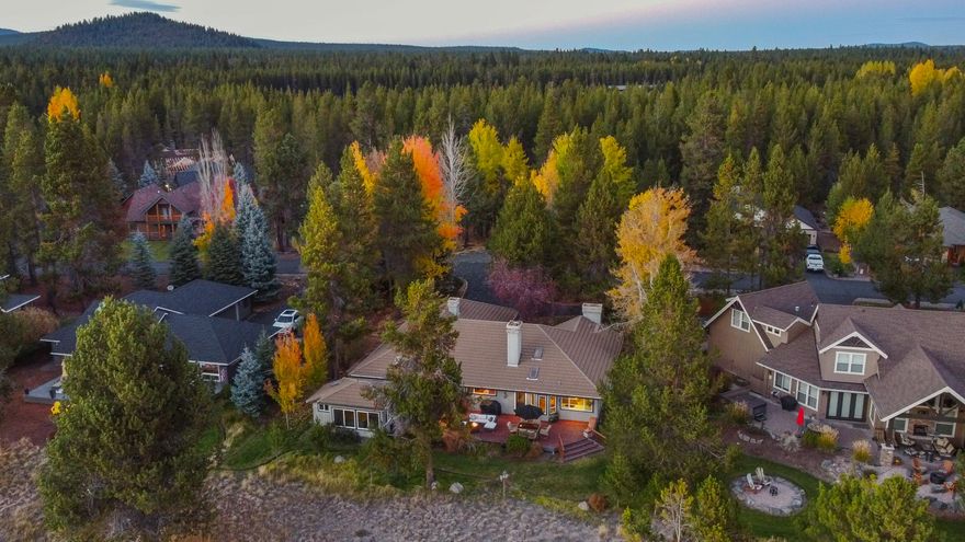 Highly sought-after single-level home along the Big Deschutes River — where windows frame a view worth pausing for. Breathtaking river views from the kitchen & the spacious primary suite, complete with an inviting sitting area & French doors leading to the patio. The enclosed, heated outdoor room, currently home to a hot tub, provides a versatile space for relaxation or hobbies after a day outdoors. This well-cared-for home offers thoughtful updates, including new carpet, recently cleaned & inspected tile roof, gutter guards, AC & built-in sound throughout. The large east-facing back patio is perfect for morning coffee or evening relaxation while taking in the serene water views. A 3-car garage provides ample space, including a wood-burning stove. Inside, the living room's wood-burning fireplace offers cozy comfort. Nestled in the charming River Meadows community, enjoy miles of bike paths, a community pool, fitness room, pickleball courts, playground, community docks & a clubhouse.
