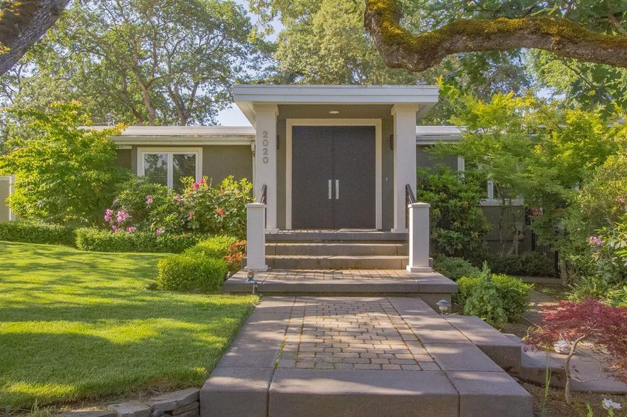 Fabulous updated home in Old East Medford. Located on a private, beautifully landscaped .30 Acre lot. Unique u-shaped home with windows framing the private patio and park-like yard from many rooms. Dream kitchen with maple floors, cherrywood cabinets, granite counter-tops, tile back-splash, island, eating bar and stainless appliances. The adjacent Dining Area could also be an additional Living space. Living Room and Den share a lovely gas fireplace with french doors to patio. Retreat to the amazing Master Suite with its custom walk-in closet, heated Travertine floor, shower w/ dual heads, soaking tub and double vanity and views of the yard. Other 2 bedrooms and full bath are on the other end of the home. All bedrooms have newer carpet. The detached garage has a great shop area w attached greenhouse. A very special home!