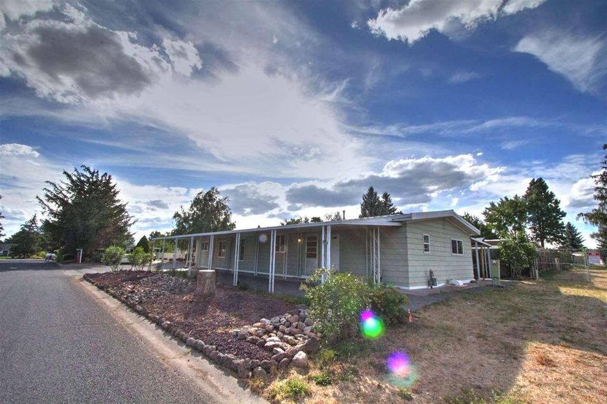 Absolutely Immaculate Double Wide In Country Green Where You Own Your Own Land. Appliances, Window, Furnace, Hot Water Heater And Carpet All Are Less Than 1 Year Old. Open Floor Plan With Excellent Natural Light. All Furnishings Negotiable. Spacious Master Suite With Handicap Accessible Shower And Walk-in Closet. Carports On Both Sides Of Home. Excellent Housing Opportunity For Right Buyer.