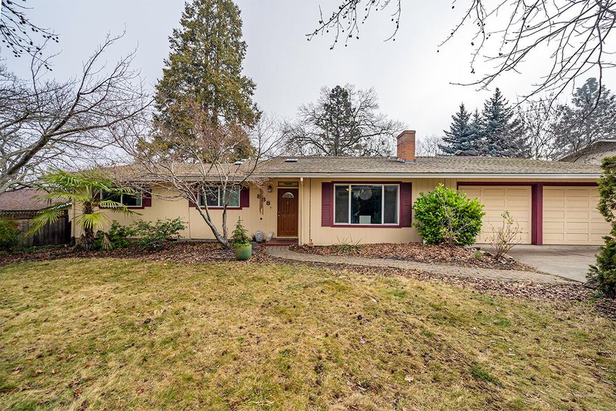 Solid single-level 2230 sf ranch style home on large lot in sought after Ashland location. Private & wonderful outdoor living area with many mature trees for shade, landscaping in front & rear, entertaining deck, & loads of room for your sunny organic garden, & a natural rock water waterfall that creates a harmonious feel to this property. The interior has multiple spacious sunlit main living areas.  Living room, hardwood floors & fireplace at entrance & a large cheerful sunroom that runs length of the
home at the rear both offer great gathering spaces. Very large kitchen with lots of counter space, tiled flooring & lovely adjacent dining room. Generous-sized primary bedroom suite with nice, tiled bath and private access to rear yard. 2 additional bedrooms & 2nd full bath. The well-lit laundry room has ample
cabinets & storage. This home has good amounts of sunshine throughout from the immense picture window in front to the sunroom in the rear. 2 car attached garage. Great property!