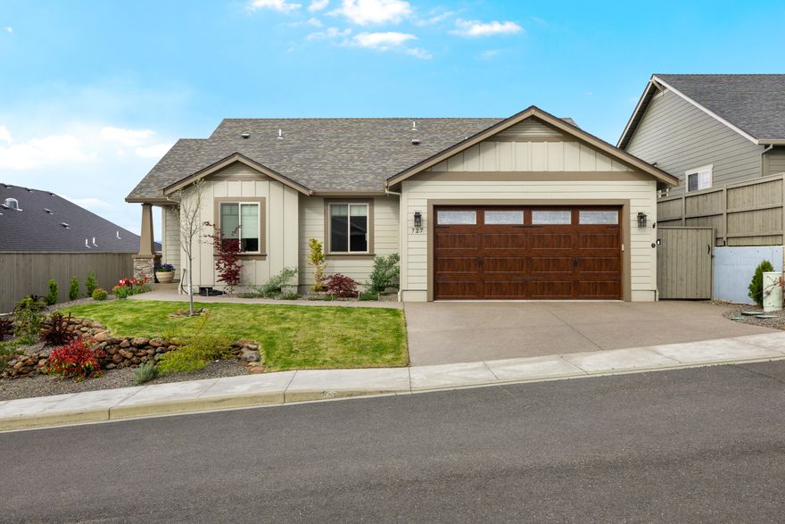 !!!Price Improvement!! Seller Motivated!!
Enjoy sweeping views of Roxy Ann mountain and the surrounding vineyards from this elegantly designed single-level Mahar built home in a premier 55+ community. Built in 2022 and Earth Advantage certified, it features vaulted ceilings, hardwood floors, and expansive picture windows that fill the space with natural light. The kitchen showcases custom cabinetry, premium stainless steel appliances, and opens to a patio with a plumbed-in BBQ—perfect for indoor-outdoor living. The landscaped yard includes fruit trees and berry bushes for seasonal charm. The primary suite offers patio access, a spacious walk-in closet, and ensuite. Two additional bedrooms add flexibility, while the attached two-car garage with climate control provides year-round comfort. All of this just minutes from restaurants, shopping, and daily conveniences.