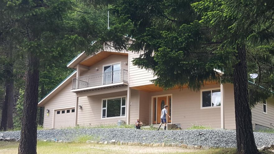 Remarkable 240 acres with lots of trails to explore. This Home is very secluded containing amazing mountain views, with private gated access. Built in 2003, this 1973 sq. ft home features 3 bedrooms 2 1/2 baths open floor plan, island kitchen with granite counters, propane range/oven, dining room with sliding doors to your back patio, woodstove and beautiful wood flooring. Master Bedroom located on main floor with  spacious en suite bath. Attached garage, RV parking plus a detached 30'x36' workshop/garage w/ woodstove and bathroom. Raised Garden Beds, a fully deer protected Chicken Coupes Paradise. This Off Grid property offers solar panel and generator back up. Property backs to BLM and County. Conveniently located only five miles from town. This home is ready for someone to enjoy the olds ways of life.